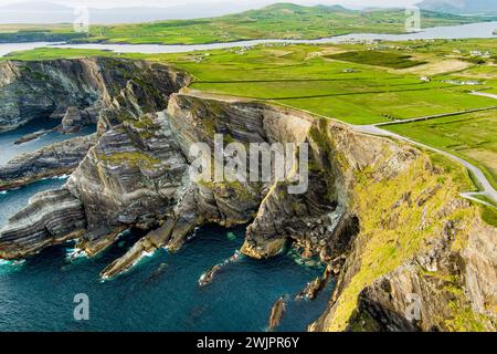 Amazing wave lashed Kerry Cliffs, widely accepted as the most spectacular cliffs in County Kerry, Ireland. Tourist attractions on famous Ring of Kerry Stock Photo