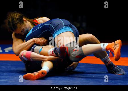 Bucharest, Romania. 16th Feb, 2024. Iryna Koliadenko (rear) of Ukraine competes against Kateryna Zelenyk of Romania in the final of Women's wrestling 65Kg category at the European Wrestling Championships in Bucharest, Romania, Feb. 16, 2024. Credit: Cristian Cristel/Xinhua/Alamy Live News Stock Photo
