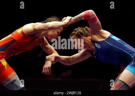 Bucharest, Romania. 16th Feb, 2024. Iryna Koliadenko (R) of Ukraine competes against Kateryna Zelenyk of Romania in the final of Women's wrestling 65Kg category at the European Wrestling Championships in Bucharest, Romania, Feb. 16, 2024. Credit: Cristian Cristel/Xinhua/Alamy Live News Stock Photo