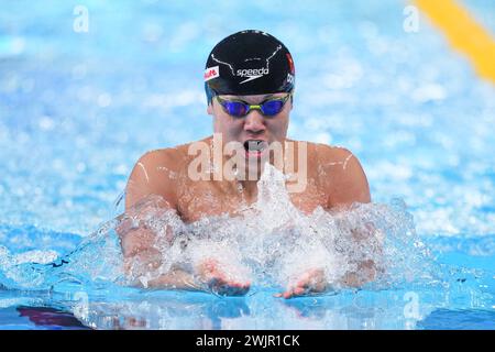 Doha, Qatar. 16th Feb, 2024. Dong Zhihao of China competes during the men's 200m breaststroke final of swimming event at the World Aquatics Championships 2024 in Doha, Qatar, Feb. 16, 2024. Credit: Du Yu/Xinhua/Alamy Live News Stock Photo