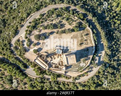 Aerial view of Ulldecona castle, Serra Grossa mountain top, former frontier fortified complex old church, emblematic circular tower and square keep Stock Photo