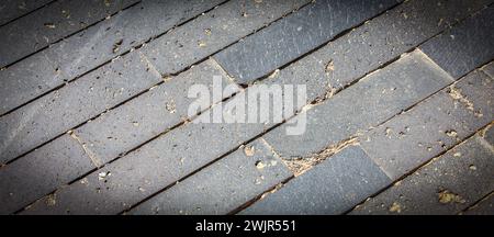 The Paving blocks made of asymmetrical stone. Selective focus Stock Photo