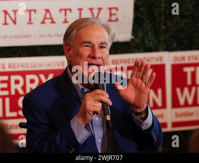 Leander, Texas, USA. 15th Feb, 2024. Texas Gov. GREG ABBOTT speaks to more than 200 supporters in suburban Austin as he campaigns on behalf of Republican State Representative Terry Wilson of House District 20 as a part of his ongoing effort to support candidates who will vote to adopt a multi-billion dollar school program that would give parents access to thousands of dollars each year to pay for private school tuition while also providing grants to public school districts for those students lost to the private school voucher program. Abbott also addressed the ongoing battle with the Biden Stock Photo