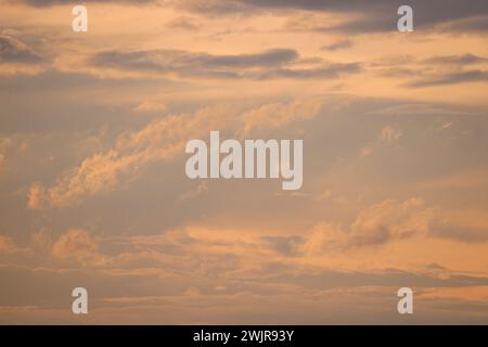 Dramatic sky at sunrise, natural background with cirrus and cumulus clouds Stock Photo