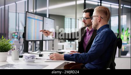 Using Corporate Invoice Spreadsheet On Computer Monitors Stock Photo