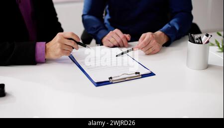 Lawyer Contract Mediation And Review. Two Reading Corporate Document Stock Photo