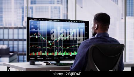 African Stock Market Analyst Business Man Using Computer Screen Stock Photo