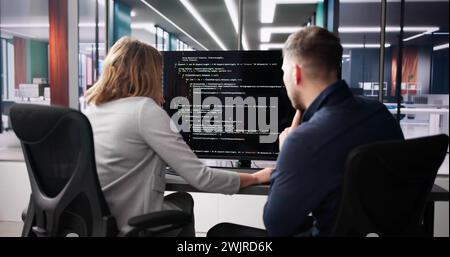 Computer Programmer Using Development Software On Laptop Stock Photo