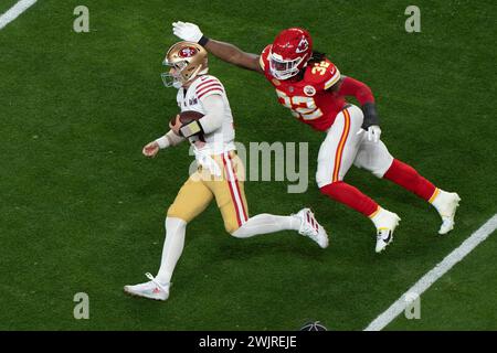 Feb 11, 2024; Las Vegas, Nevada, USA;  San Francisco 49ers quarterback Brock Purdy (13) runs with the Football during the second quarter against Kansas City Chiefs linebacker Nick Bolton (32) at Allegiant Stadium during Super Bowl LVIII. Mandatory Credit: Stan Szeto - Image of Sport Stock Photo