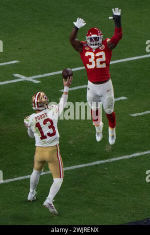 Feb 11, 2024; Las Vegas, Nevada, USA;  San Francisco 49ers quarterback Brock Purdy (13) throws the Football during the fourth quarter against Kansas City Chiefs linebacker Nick Bolton (32) at Allegiant Stadium during Super Bowl LVIII. Mandatory Credit: Stan Szeto - Image of Sport Stock Photo