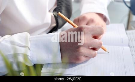 Recording a business sales report Stock Photo