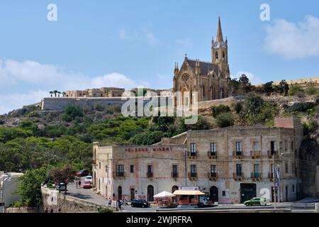 Parish Church of Our Lady of Loreto above the harbour of Mgarr on the island of Gozo - Ghajnsielem, Malta Stock Photo