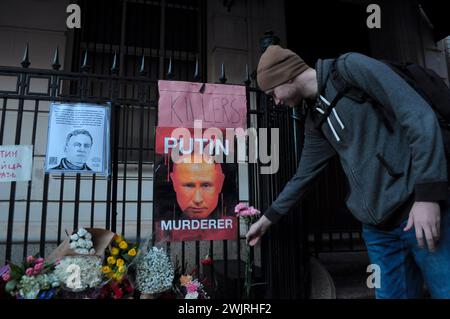 A demonstrator places flowers at a vigil for Alexei Navalny. The vigil took place outside the Consulate General of the Russian Federation in the borough of Manhattan in New York City. According to a report by the Russian prison service, Alexei Navalny, a former lawyer and critic of Vladimir Putin, died in jail in a Russian penal colony north of the Arctic Circle. U.S. President Joe Biden blamed Putin for Navalny's death. Navalny was serving a combined prison sentence of more than 30 years. (Photo by Jimin Kim/SOPA Images/Sipa USA) Stock Photo