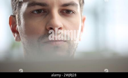 Male businessman in close-up working on a laptop Stock Photo