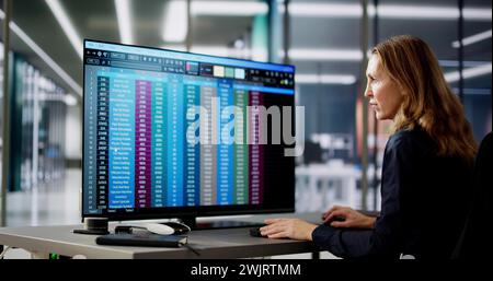 Data Analyst Woman Using Spreadsheet On Computer Stock Photo
