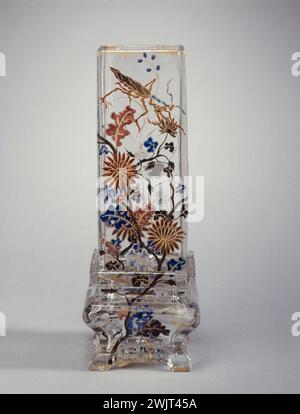 Emile Gallé. 'Quadrangular vase of traditional Chinese shape decorated with chrysanthemums and religious mantis and console base with flowers decoration, in thick transparent white glass, polychrome enamels and gilding, around 1880 (view together face A)'. Glass and enamel. Museum of Fine Arts of the City of Paris, Petit Palais. 26989-13 China, Chinese, chrysantheme, console, decor, gilding, polychrome email, flower, traditional shape, insect, nun mantle, decorative object, base, transparent thick, quadrangular vase, white glass Stock Photo