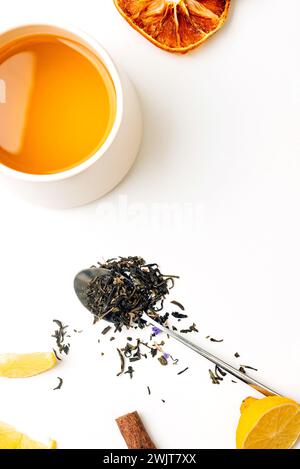 Tea composition teapot and teacup with tea bags on white table. Flat lay. Top view. Stock Photo