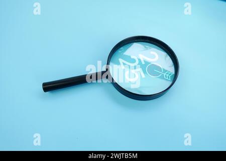 Magnifying glass and targets 2025. Concept of new year 2025, beginning of success, challenge or career path, change, planning, goals, challenges and n Stock Photo