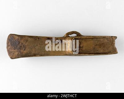 Heel ax. Bronze Age. Copper alloy, cast iron. Coming from: Lit de la Seine. Paris, Carnavalet museum. Bronze Age, Copper alloy, Arm, Ax, Weapon, Bronze Age, Copper Alloy, Fonte, Hache A Talon, Iron Cast, Tool, Protohistoire, Prothistoric, Prothistorique, Prothistory, Tool, Head, Shot, Sword, Weapon Stock Photo