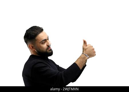 A man, close-up, on a white background, shows his thumbs up Stock Photo