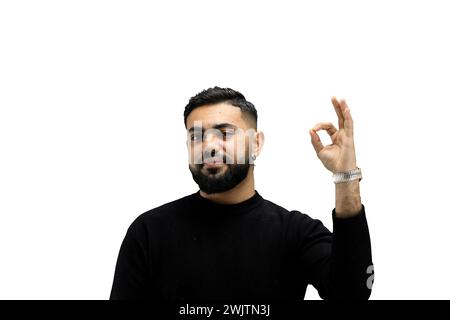 A man, close-up, on a white background, shows an ok sign Stock Photo