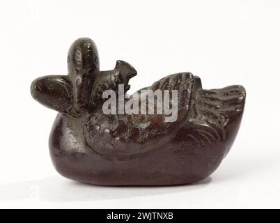 Duck holding a fish. Bronze. Japan. Paris, Cernuschi museum. Animal, Japanese art, bronze, duck, fish, hold, animal Stock Photo