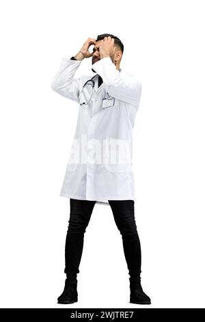 The doctor, in full height, on a white background, clutched his head Stock Photo