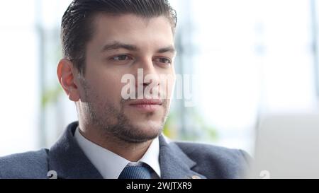 A male businessman works in an office Stock Photo