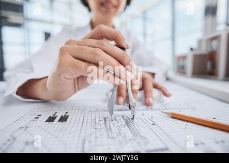 female architect designer working on blueprints Stock Photo