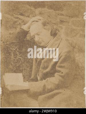 Victor Hugo reading in front of a stone wall. 1853-1855. Photograph by Charles Hugo 1826-1871) or Auguste Vacquerie (1819-1895). Paris, house of Victor Hugo. 56434-14 French writer, read, book, stone wall, portrait Stock Photo