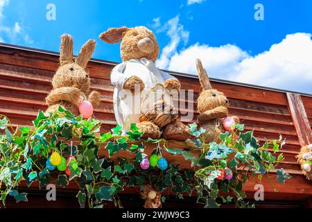 Easter decoration with Easter bunnies and Easter eggs on a house Stock Photo