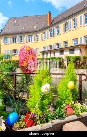 Flowerbed with flowers and Easter decoration at spring Stock Photo