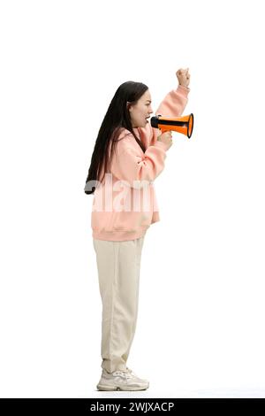 A woman, full-length, on a white background, with a megaphone Stock Photo