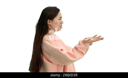 A woman, close-up, on a white background, spreads her arms Stock Photo