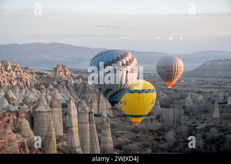 Göreme's Dawn: A Symphony of Balloons at Cappadocia's Sunrise Stock Photo