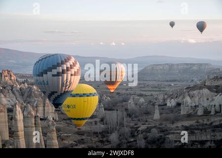 Göreme's Dawn: A Symphony of Balloons at Cappadocia's Sunrise Stock Photo