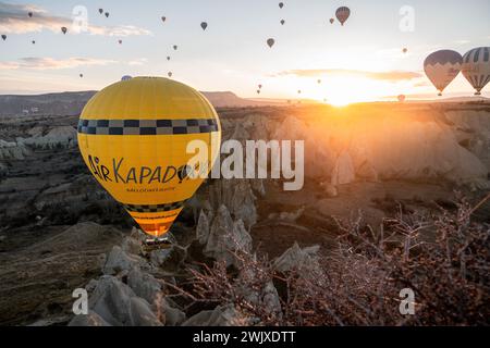 Göreme's Dawn: A Symphony of Balloons at Cappadocia's Sunrise Stock Photo