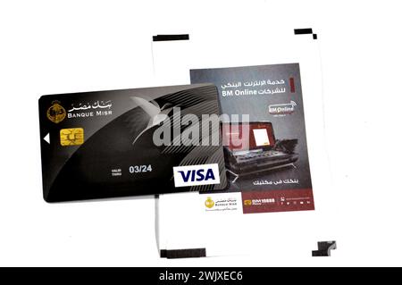 Cairo, Egypt, February 12 2024: ATM receipt paper of Egypt's Bank and Banque Misr or Egypt Bank electronic payment VISA card for domestic transactions Stock Photo