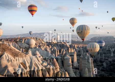 Göreme's Dawn: A Symphony of Balloons at Cappadocia's Sunrise Stock Photo