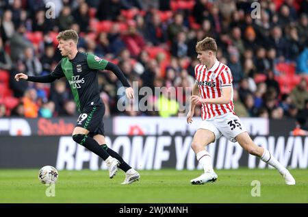 Coventry City's Victor Torp (left) and Stoke City's Nathan Lowe during the Sky Bet Championship match at the Bet365 Stadium, Stoke-on-Trent. Picture date: Saturday February 17, 2024. Stock Photo