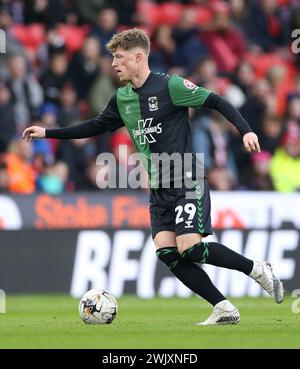 Coventry City's Victor Torp (left) and Stoke City's Nathan Lowe during the Sky Bet Championship match at the Bet365 Stadium, Stoke-on-Trent. Picture date: Saturday February 17, 2024. Stock Photo