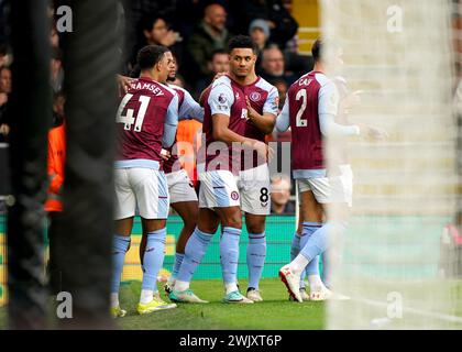 Aston Villa's Ollie Watkins (centre) celebrates with team-mates after scoring their side's first goal of the game during the Premier League match at Craven Cottage, London. Picture date: Saturday February 17, 2024. Stock Photo