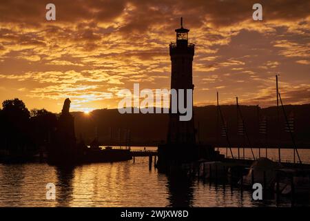 Germany, Lindau, Lake Constance, Bavaria, old town island, lighthouse, Bavarian lion, statue, harbor, Mangturm, Sunrise Stock Photo