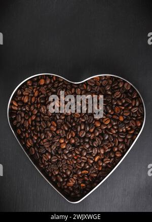 Coffee beans texture or coffee beans background. Brown roasted coffee beans. Closeup shot of coffee beans. Many coffee beans. Coffee beans can be used Stock Photo