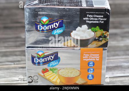 Cairo, Egypt, February 12 2024: Domty feta cheese plus cheddar, olives flavor, produced using pasteurized cow and buffalo milk, can be used to add a c Stock Photo