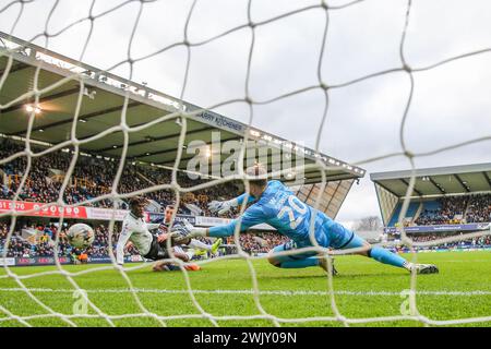 London, UK. 17th Feb, 2024. Sheffield Wednesday forward Ike Ugbo (12) scores a GOAL 0-1 past Millwall goalkeeper Matija Šarkic (20) during the Millwall FC v Sheffield Wednesday FC sky bet EFL Championship match at The Den, London, England, United Kingdom on 17 February 2024 Credit: Every Second Media/Alamy Live News Stock Photo