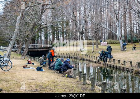 Locals fishing at the Mizumoto Park (都立水元公園). Tokyo, Japan. Stock Photo