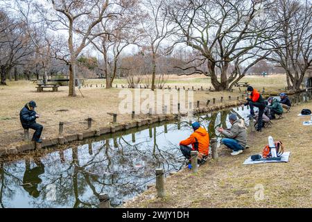 Locals fishing at the Mizumoto Park (都立水元公園). Tokyo, Japan. Stock Photo