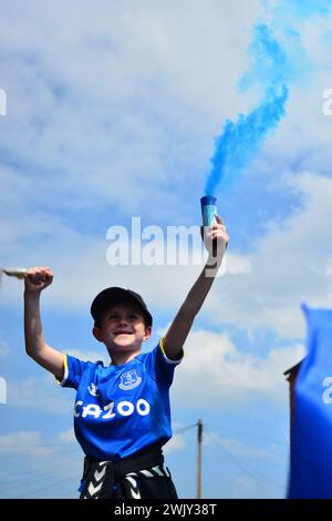 Everton fans demonstrate against the 10 point deduction imposed on the club for breaking PSR Rules. Stock Photo