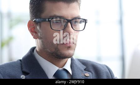 A male businessman works in an office Stock Photo